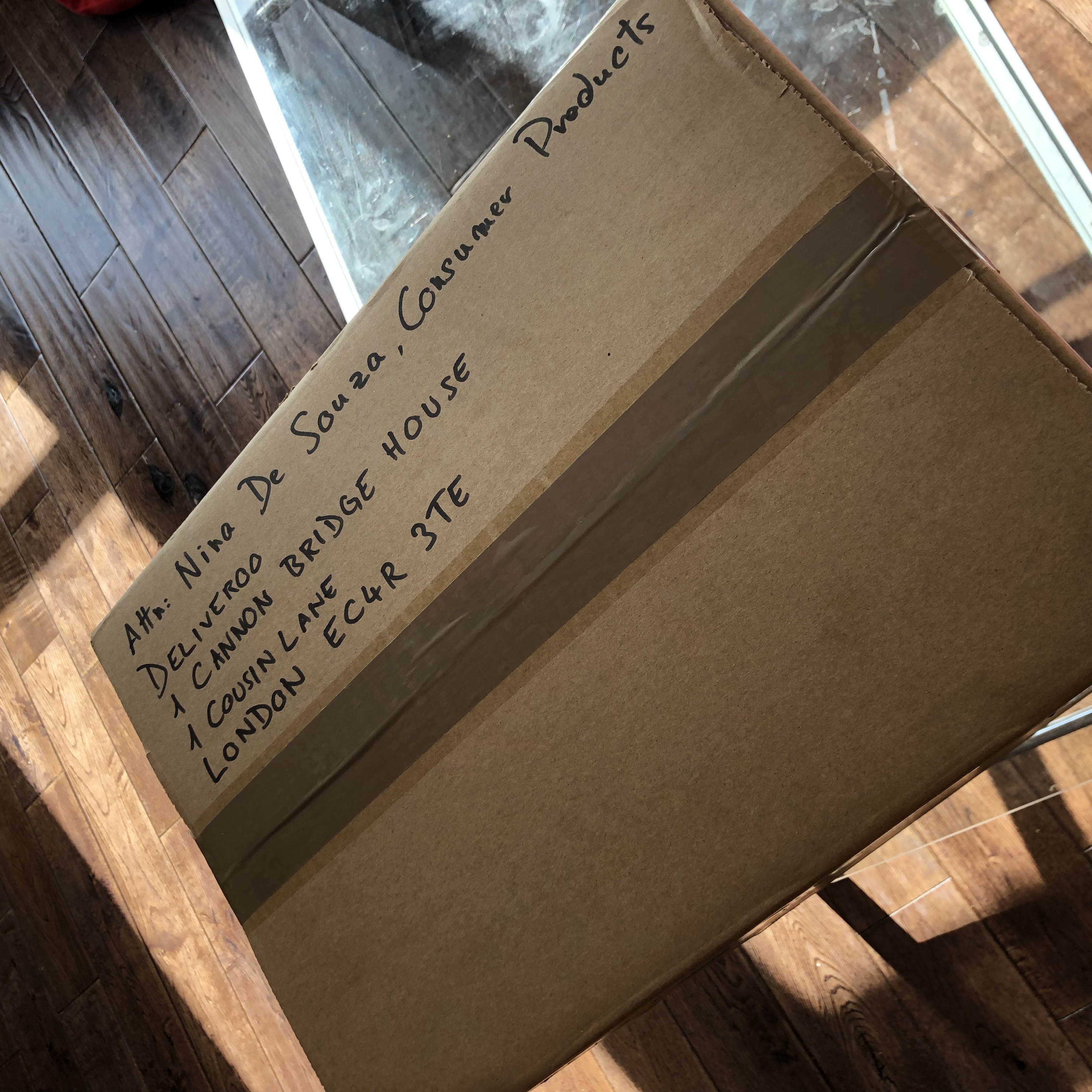 The top of the box with Nina De Souza's address at Deliveroo
